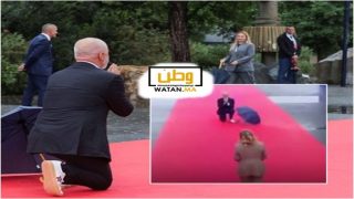 رئيس وزراء ألبانيا يجثو على ركبته في استقبال رئيسة الوزراء الإيطالية