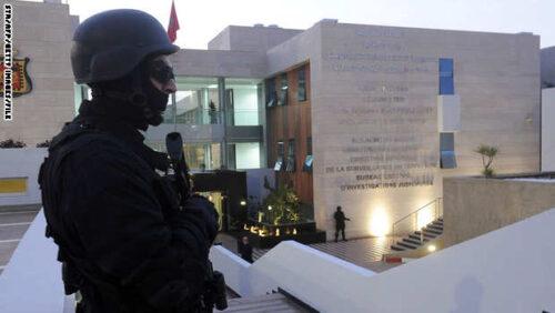 A member of the Moroccan special forces guard stands outside of the Central Bureau of Judicial Investigation (BCIJ) building on March 23, 2015 during a press conference by the governor of the BCIJ in Rabat. Moroccan authorities said on March 23 that a "terrorist cell" they dismantled had brought in arms through the Spanish enclave of Melilla to carry out attacks for the Islamic State jihadist group. The cell was made up of 13 members aged between 19 and 37, most of them without primary school education, said Abdelhak Khiame, head of Morocco's newly-formed judicial investigations agency. AFP PHOTO / STR (Photo credit should read STR/AFP/Getty Images)