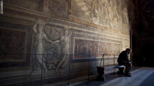 VATICAN CITY, VATICAN - MARCH 21: A visitor takes a break in the Vatican Museum's Raphael Room's on March 21, 2013 in Rome, Italy. (Photo by Dan Kitwood/Getty Images)